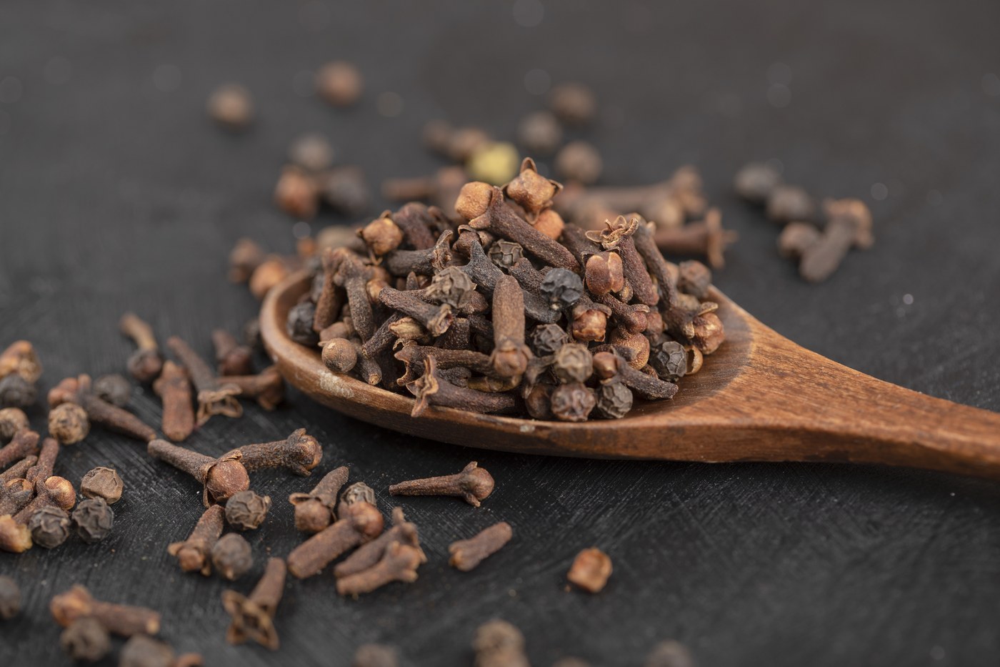 Dried cloves on spoon